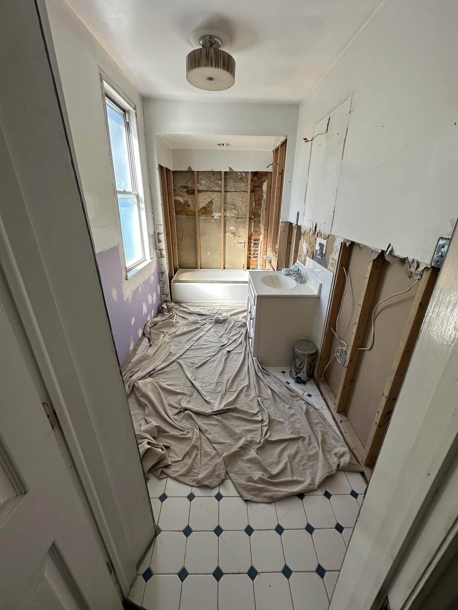 Bathroom gutted to the studs before a remodel.