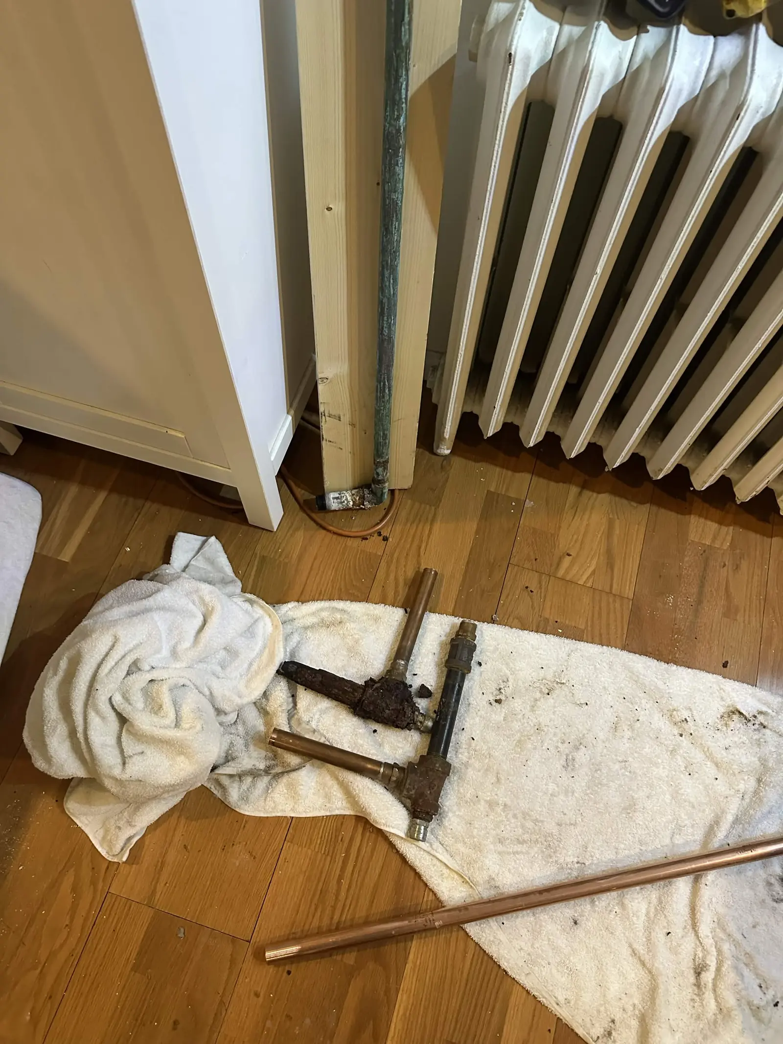 Old pipe and fittings removed during a leak repair.