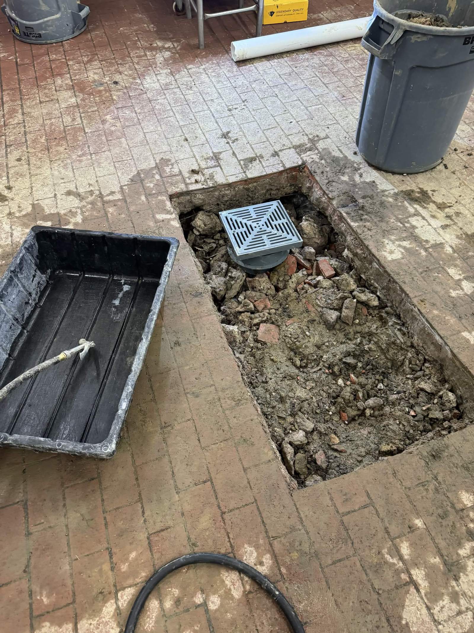 Restaurant kitchen floor opened up to replace a floor drain.