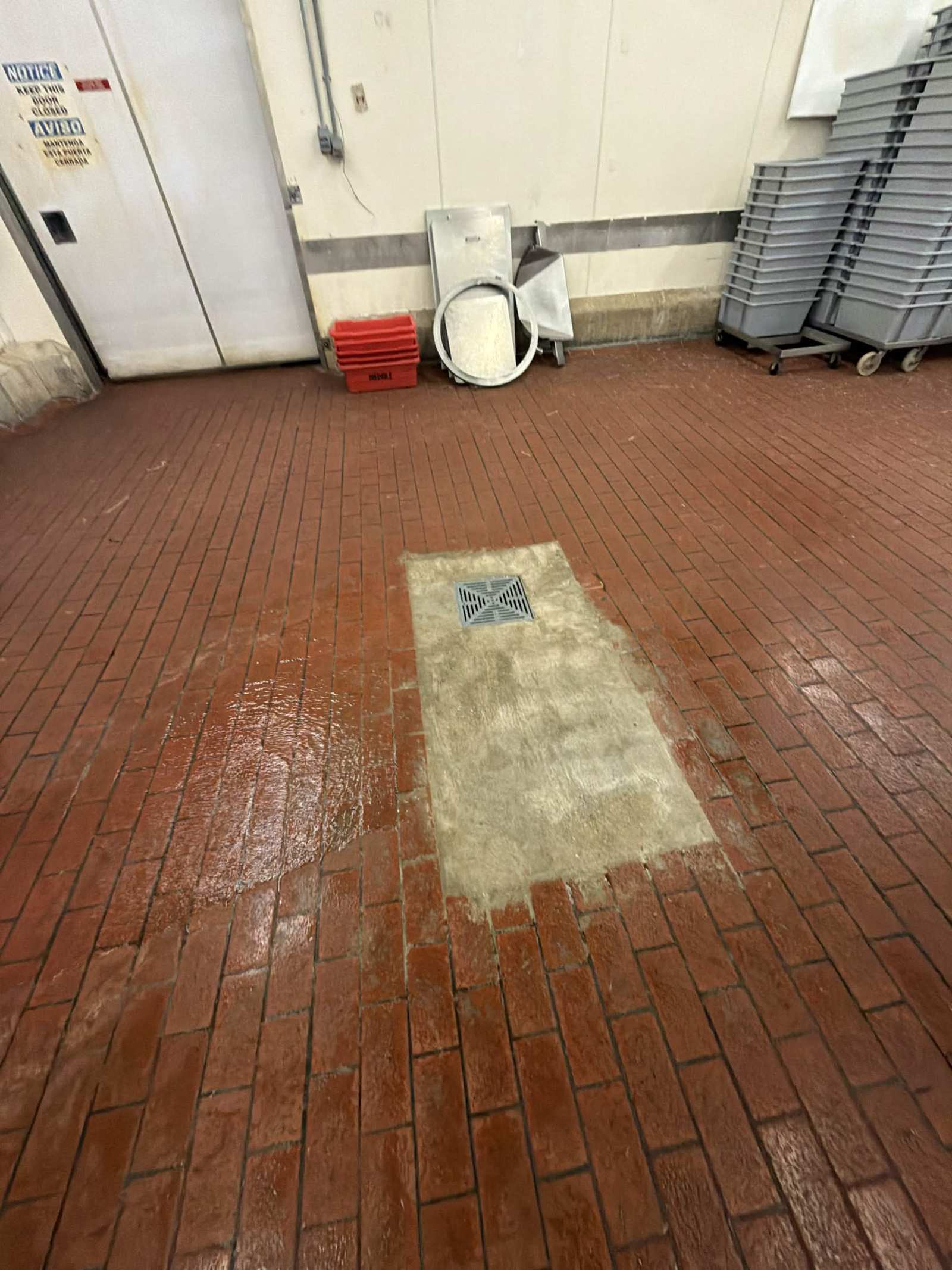 New floor drain set in a restaurant kitchen floor.