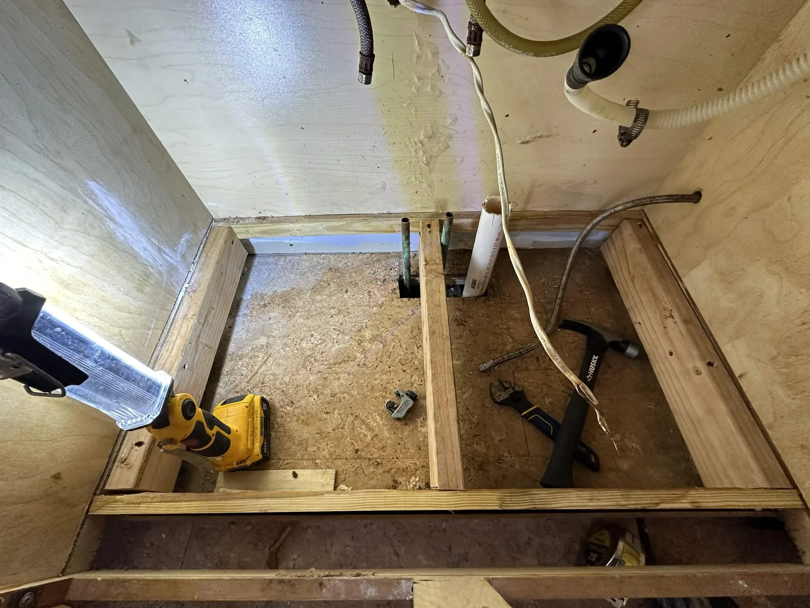 During: the cabinet base opened up for the work.
